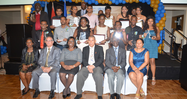 Winners of the Clare Forrester PAHO/WHO Media Awards for Excellence in Health Journalism pose with PAHO/WHO Country Representative Dr William Adu-Krow, Health Minister Dr George Norton, Junior Health Minister Dr Karen Cummings, Chief Judge Dr Paloma Mohamed and members of the diplomatic corps (Delano Williams photo)