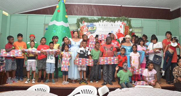 Some of the orphans who received gifts in the presence of Disney characters (Delano Williams Photo)