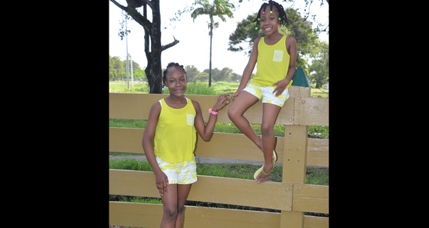TIMERA & TROSHONNA chose short shorts and and matching tank tops for the warm weather; fashion-conscious kids will always opt for comfort, especially when playing and romping around the backyard.