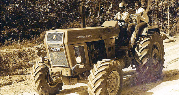 Hitching a ride to Yukuriba Falls on a Demerara Woods (now Demerara Timbers)
tractor.