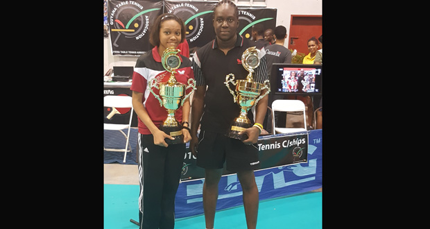 Christopher Franklin and Chelsea Edghill pose with their trophie after taking the men’s and women’s singles  titles last Sunday.s