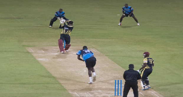Chris Gayle smashes Jason Holder down the ground for one of his of his eleven sixes on Saturday night.