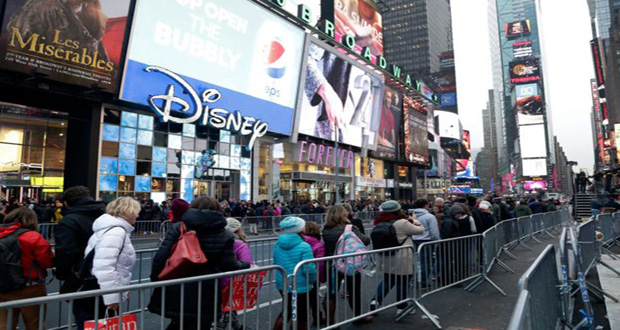 Persons streaming into Times Square, New York