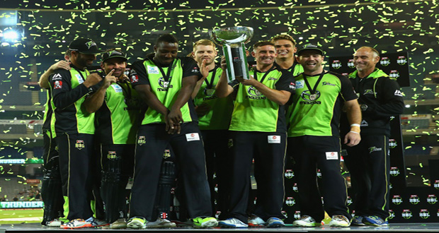 Moment to savour ... Thunder captain Mike Hussey celebrates with his troops and the trophy after winning the Big Bash final. (AAP: Mal Fairclough)