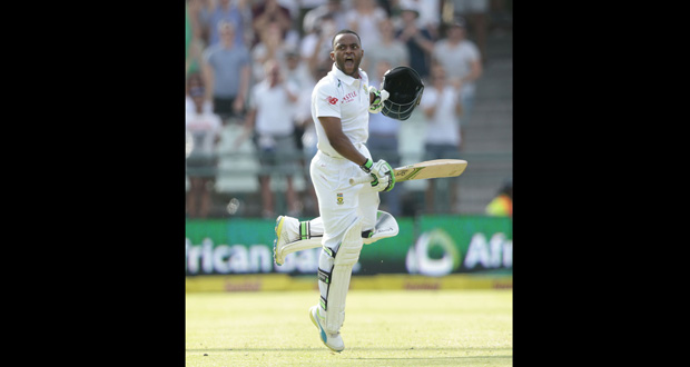 Batsman Temba Bavuma celebrates after making history in becoming the first black South African man to score a Test century, during the fourth day of the second Test against England. (Daily Mail)