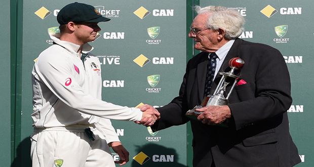 Steven Smith is congratulated by former Aussie legend Alan Davidson before receiving the Frank Worrell Trophy on the fifth day in Sydney.