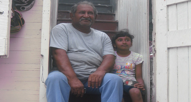 Little Danya Padarat with her grandfather, Chunilall Basdeo