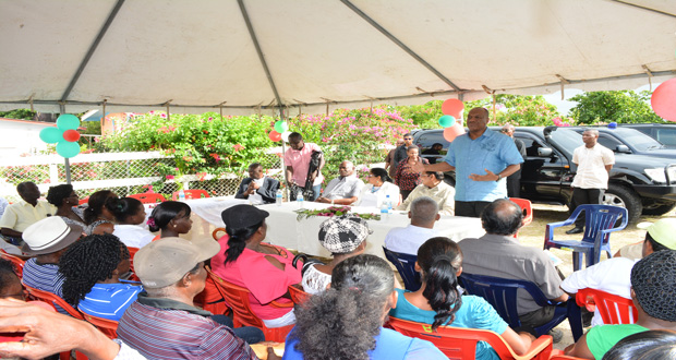 Minister of State, Joseph Harmon, addressing the residents of Aurora on Thursday afternoon after delivering the cheque for $217,500 for infrastructure development (Samuel Maughn photo)