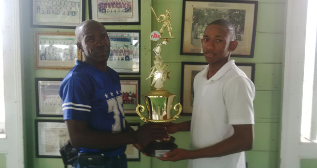 Devon Lord (right) and Lyndon Lyght pose with the winning trophy