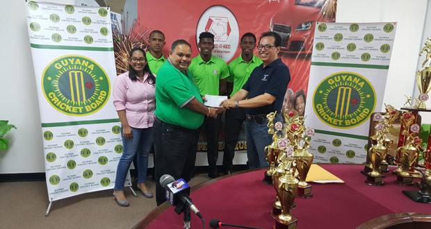 Director and Fire Manager Howard Cox hands over the sponsorship
cheque to GCB president Drubahadur in the presence of another
staff member of Hand-in-Hand and Guyanese trio Shimron
Hetmyer, Keemo Paul and Tevin Imlach, who represented West
Indies at the just concluded ICC Youth World Cup.