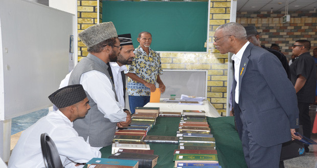 President David Granger learning more of the Muslim faith shortly after the launch
