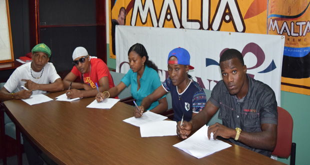 Local professional boxers put their signatures to their contracts for the GBBC’s `Hostile Territory’ card set for the Giftland Mall on February 27. (Cullen Bess-Nelson photo)