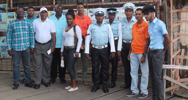 Posing for a photo opportunity before getting the job done during the Vreed-en-Hoop Stelling outreach