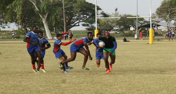 UG Wolves captain Ryan Dey powers his way past the hapless GPF Falcons defence during the GRFU 15s League at the National Park. (Photo compliments of the GRFU)