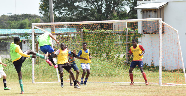 Part of the action between Cummings Lodge and Kingston Community High in the Petra organized Milo U-20 Schools Football Tournament. (Cullen-Bess Nelson Photo)