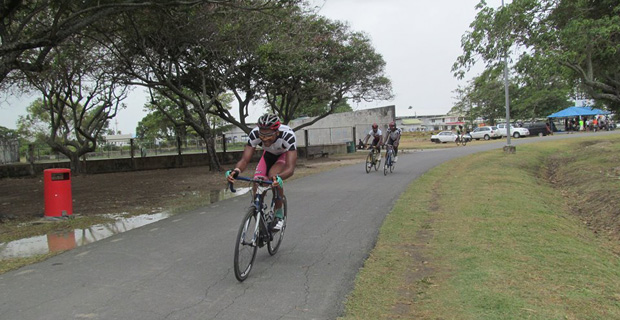 Team Gillette Evolution’s Michael Anthony crosses the finish line all alone to win the feature 35-lap event of the R&R International Limited- sponsored cycle programme in the National Park yesterday.