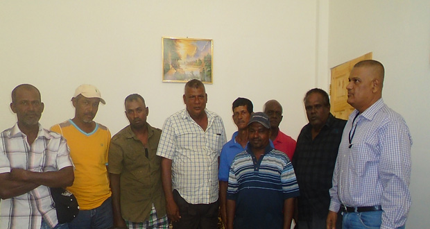 Special Assistant to Prime Minister Moses Nagamootoo Gobin Harbajan (second right) meeting with some of the affected farmers at Lesbeholden Black Bush Polder