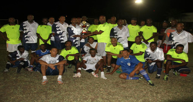 Georgetown All-Stars collect their trophy from GFA executive member Frank Parris.