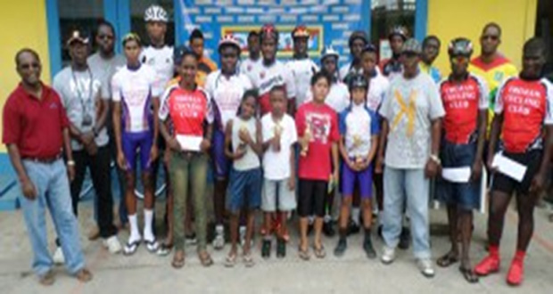 Prize-winners of the various categories in the COURTS Guyana Independence 50-mile cycle road race strike a pose with COURTS Guyana New Amsterdam Branch manager Stanley McKenzie (extreme left).