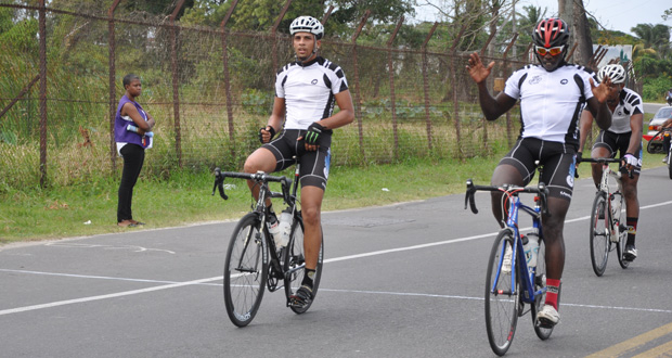 Team Evolution’s trio! Orville Hinds (right) raises his hand in triumph as he crosses the finish line. At left is overall winner Raul Leal while teammate Marlon ‘Fishy’ Williams is just behind.