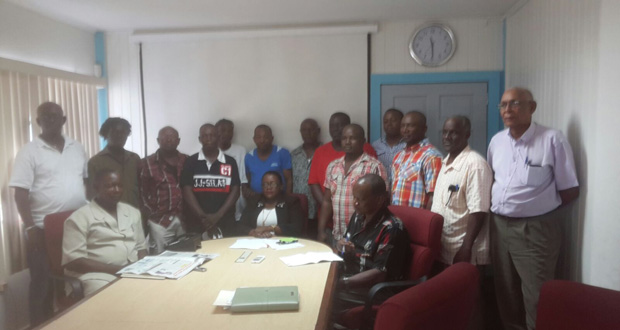 GTUC General Secretary Lincoln Lewis and the workers at the meeting with Minister Broomes