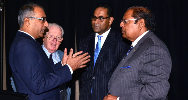Member of Parliament Nepean Chandra Arya makes a point to Prime Minister Moses Nagamootoo in the presence of Senator David Smith (second left) and CPA Secretary-General Akbar Khan (second right)