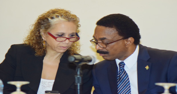 Attorney General and Legal Affairs Minister Basil Williams and IDB Representative Sophie Makonnen discussing components of the Cybercrime Bill during the forum