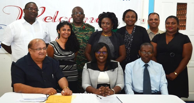 Minister within the Ministry of Public Health, Dr. Karen Cummings (centre), is flanked by members of the new GPHC Board, including the Chairman, Dr Max Hanoman (seated at extreme left)
