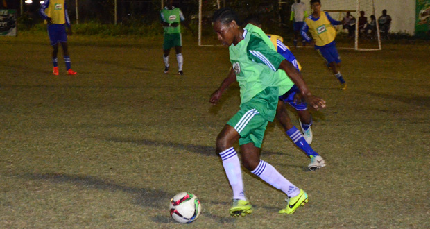 Chase Academy’s Jobe Caesar controls the ball during their 6-0 semi-final rout of South Ruimveldt Secondary School.