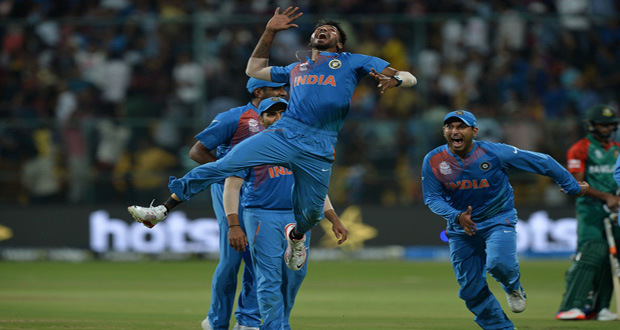 Seamer Hardik Pandya celebrates one of his two wickets in the final over of the match in Bangalore.