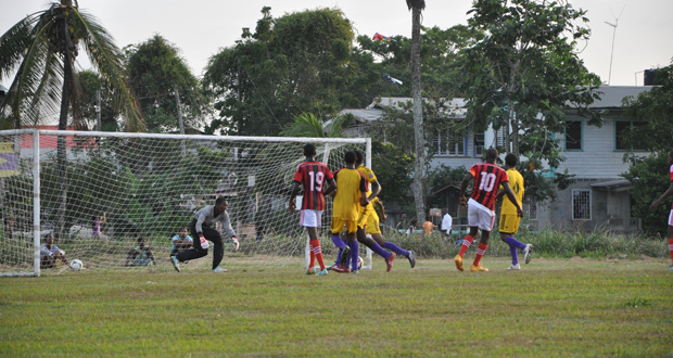 Agricola’s Red Triangle captain Winston Rawlins (#10) scores his team’s sixth goal in the 61st minute against Diamond.