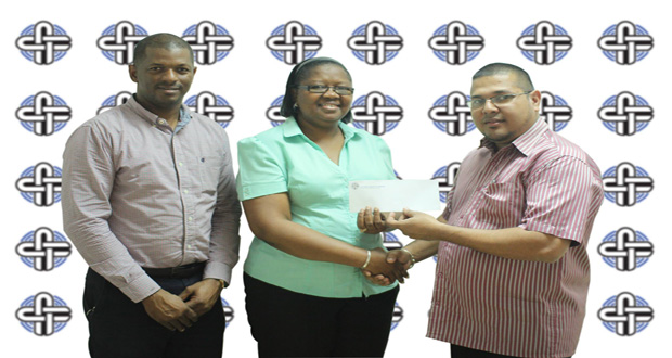 Avalon Jagnandan, Marketing and Sales Manager for Continental Group of Companies, hands over sponsorship cheque to Ms Deirdre Edghill in the presence of Godfrey Munroe, president of the GTTA.