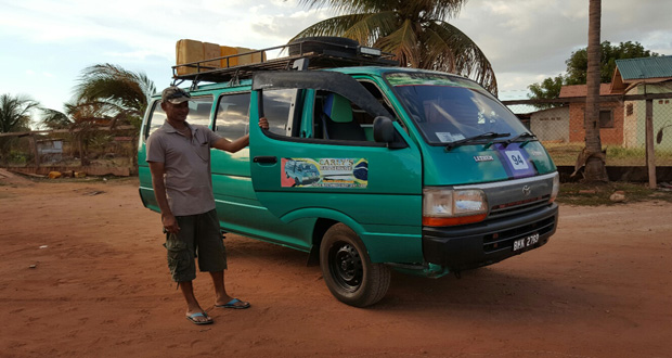 Derrick Paul posing in front of his mini bus in Lethem after completing a trip from Georgetown recently