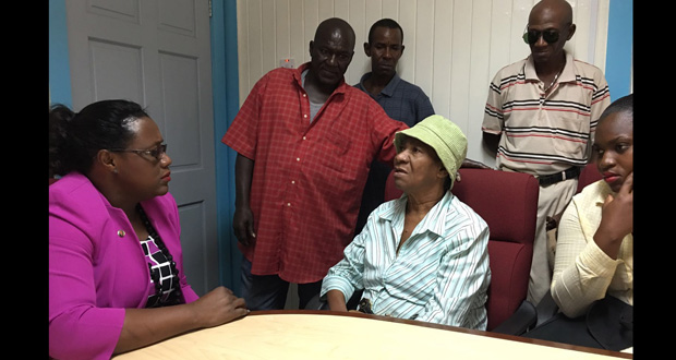 Minister Simona Broomes sharing a moment with visually impaired Winifred Garraway at last Wednesday’s Open Day session