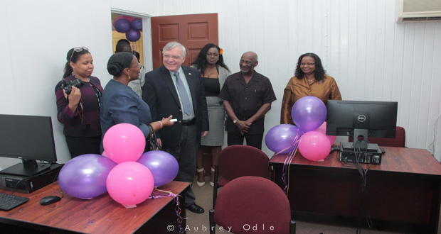 Minister of Social Protection, Volda Lawrence and Minister within the Ministry Keith Scott interacting with Canadian High Commissioner to Guyana, Mr. Pierre Giroux and other officials of the ministry