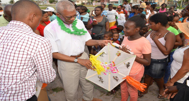 This teenager was all smiles as President David Granger presented her with a kite, during his visit to the Roxanne Burnham Gardens playfield