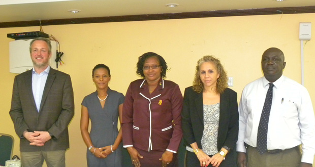Minister within the Ministry of Public Infrastructure, Annette Ferguson, (centre) with, from left: Arran De Moubray, Technical Project Coordinator of CARIBSAVE; Judi Clarke, Caribbean Regional Director of CARIBSAVE; Sophie Makonnen, IDB Representative; and Horace Williams, CEO of the Hinterland Electrification Company Inc