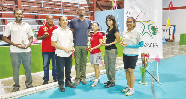Archery Guyana/NSC's 50 Shades of Games prize-winners pose with the Director of Sport.