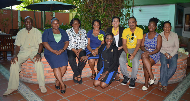 Ms. Thomas (stooping) poses with Georgetown Mayor Patricia Chase-Green and other colleagues at a Councillors’ workshop recently.