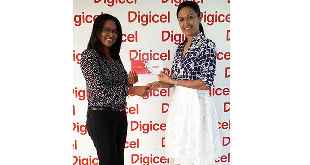 Digicel's Public Relations Officer, Vidya Bijlall-Sanichara, hands over a cheque to Marcelle Shewjattan, Secretary of the QCPTA