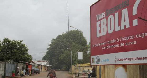 A billboard with a message about Ebola is seen on a street in Conakry, Guinea in this October 26, 2014 file photo.