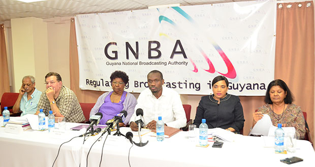 Chairman of GNBA Board, Leonard Craig (centre) flanked by board members at a press conference.