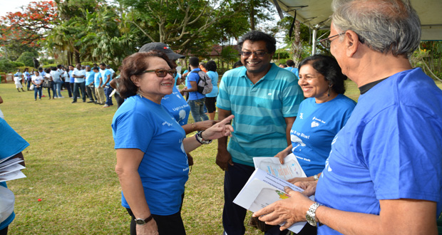 First Lady Sandra Granger (left) shares a warm exchange with Minister of Public Security, Khemraj Ramjattan (centre) and his wife, Sita Ramjattan and Minister of Education, Dr. Rupert Roopnaraine (first right) on her arrival at the Promenade Gardens  