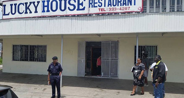 New Amsterdam Town Council officials at the Lucky House Chinese Restaurant shortly after the eating house was issued with a close order
