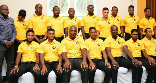 Members of the Guyana Jaguars PCL team pose with managers and their newly minted rings each featuring a semi-precious stone and the engraving of the two championship years. (Samuel Maughn photos)
