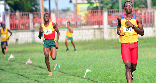 GPF’s Winston Dummett (first from right) finishes in first place, followed by GDF’s Edwin Tudor, in the men’s sprint medley, where both teams were disqualified for unsportsmanlike behaviour.