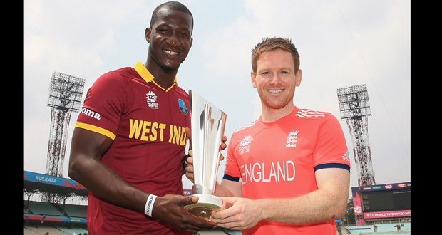 Darren Sammy and Eoin Morgan with the World T20 trophy in Kolkata, yesterday. (ESPN Cricinfo photo)