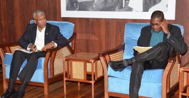 President David Granger makes a point to Minister of Public Infrastructure,David Patterson during Tuesday's meeting.