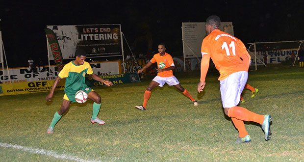 Part of the action of the GFF’s Stag Elite Beer tournament between Fruta Conquerors (orange top) and GDF at the Tucville ground on Friday evening. Fruta Conquerors won the game 5-2
