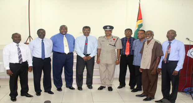 Members of the Management Committee of the Fallen Heroes Foundation pose with the Minister of Public Security. Khemraj Ramjattan, and the Commissioner of Police, Seelall Persaud